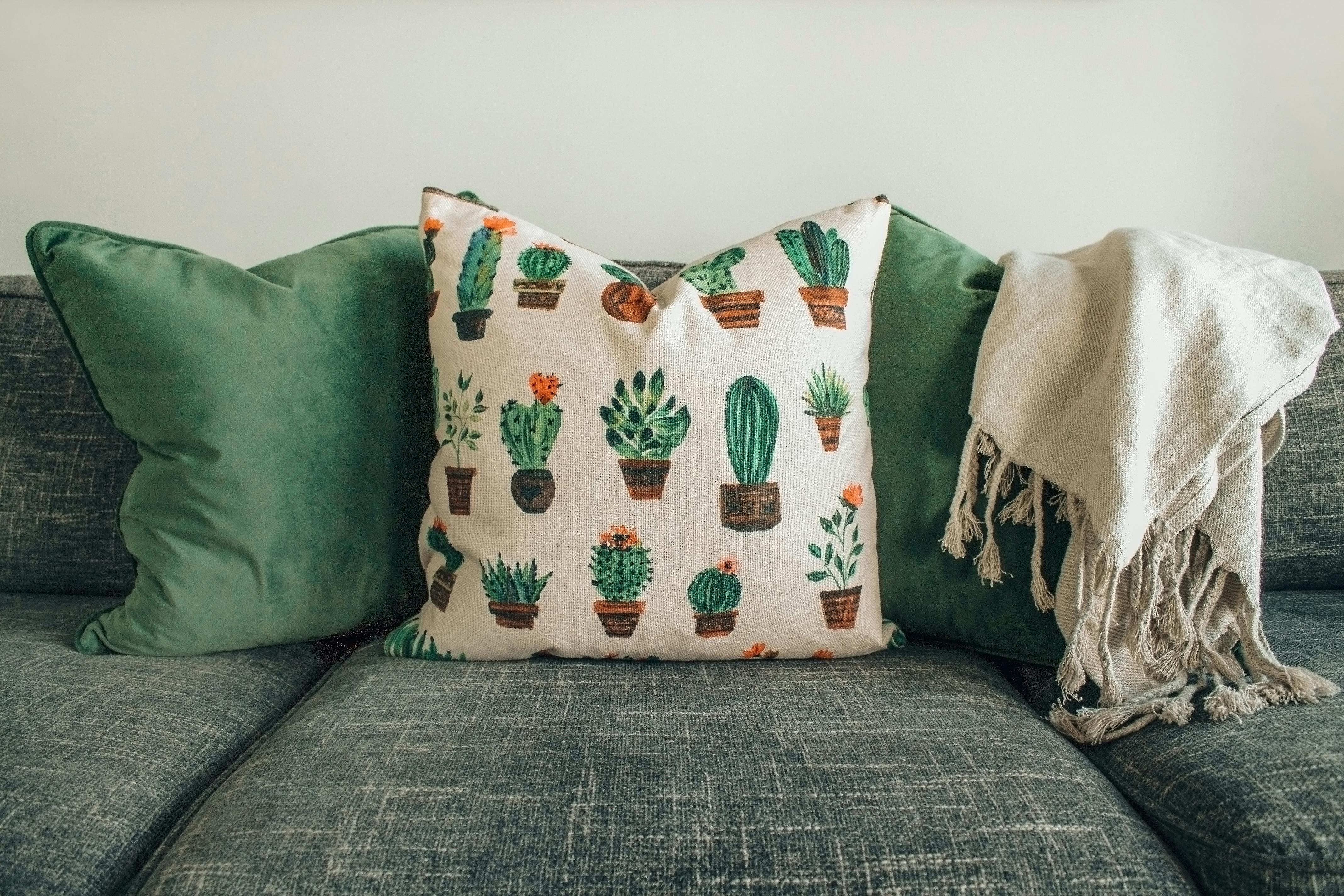 Soft neutral cushion cover on a light fabric sofa